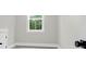 Bedroom featuring neutral walls, carpet flooring, white trim, and a window with beautiful views at 202 Countryside Way, Summerville, SC 29483