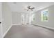 Spacious carpeted bedroom with ample natural light, neutral walls, and access to the bathroom at 202 Countryside Way, Summerville, SC 29483