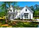 Stunning two-story home with a modern farmhouse design and a beautifully landscaped front yard at 202 Countryside Way, Summerville, SC 29483