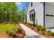 Close up view of an impressive two-story home with a well-maintained lawn and lovely landscaping at 202 Countryside Way, Summerville, SC 29483