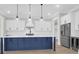 Beautiful kitchen features a large center island with a white countertop and stainless steel appliances at 202 Countryside Way, Summerville, SC 29483