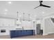 Stunning kitchen showcases a large center island with dark blue cabinetry and stainless steel appliances at 202 Countryside Way, Summerville, SC 29483