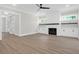 Spacious living room boasts a cozy fireplace with custom built-ins and ample natural light at 202 Countryside Way, Summerville, SC 29483