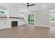 Bright and open living room with hardwood floors, a fireplace, and a sliding glass door at 202 Countryside Way, Summerville, SC 29483