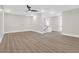 Open loft area with modern ceiling fan, hardwood floors, and staircase access at 202 Countryside Way, Summerville, SC 29483