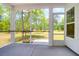Relaxing screened-in porch offering an excellent view of the backyard at 202 Countryside Way, Summerville, SC 29483