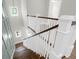 Elegant staircase with white railings, hardwood treads, and natural light from windows at 202 Countryside Way, Summerville, SC 29483