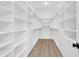 Spacious walk-in closet with custom shelving, drawers, and ample storage space at 202 Countryside Way, Summerville, SC 29483