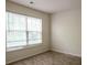 Bedroom with neutral colored walls, standard carpeting and a bright window at 206 Trickle Dr, Summerville, SC 29483