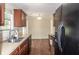 Galley kitchen featuring stainless steel appliances, double sink, and wood-look flooring at 206 Trickle Dr, Summerville, SC 29483