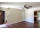 Open-concept living area with wood floors, neutral walls, and ceiling fan at 206 Trickle Dr, Summerville, SC 29483
