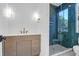 Modern bathroom with tiled shower, stylish vanity, and updated lighting at 2151 River Road, Johns Island, SC 29455