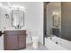 Bathroom with dark wood vanity, shower over tub, marble floors, and modern fixtures at 2151 River Road, Johns Island, SC 29455