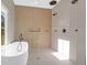 Modern bathroom with soaking tub, glass enclosed shower, and multiple shower heads at 2151 River Road, Johns Island, SC 29455