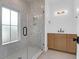 Modern bathroom showcasing a walk-in shower, stylish vanity, and natural light from the window at 2151 River Road, Johns Island, SC 29455