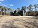 A view of a home under construction surrounded by tall trees at 2151 River Road, Johns Island, SC 29455