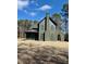 A two-story home with a chimney and a covered entry way under a blue sky at 2151 River Road, Johns Island, SC 29455