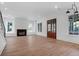 Spacious living area featuring hardwood floors, a fireplace, and modern recessed lighting at 2151 River Road, Johns Island, SC 29455