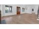 Bright and airy living room with hardwood floors, large windows, and modern light fixture at 2151 River Road, Johns Island, SC 29455