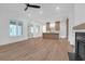 Spacious living area with hardwood floors, open layout, fireplace, and eat-in kitchen at 2151 River Road, Johns Island, SC 29455