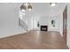 Spacious living area featuring hardwood floors, a fireplace, and modern recessed lighting at 2151 River Road, Johns Island, SC 29455