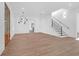 Bright and airy living room with hardwood floors, large windows, and modern light fixture at 2151 River Road, Johns Island, SC 29455