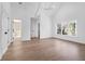 Spacious main bedroom featuring vaulted ceilings, wood floors, large windows, and an ensuite bathroom at 2151 River Road, Johns Island, SC 29455