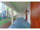 Spacious covered porch featuring white columns and a slate tile floor at 2151 River Road, Johns Island, SC 29455