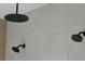 Modern shower featuring three shower heads and neutral toned tile at 2151 River Road, Johns Island, SC 29455