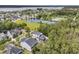 An aerial view features the home's surroundings, including a pond, tennis courts, and community amenities at 2197 Sandy Point Ln, Mount Pleasant, SC 29466
