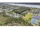 Picturesque aerial shot of homes surrounded by lush greenery and recreational facilities near the waterfront at 2197 Sandy Point Ln, Mount Pleasant, SC 29466
