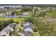Scenic aerial view of the neighborhood, with a pond, tennis courts, and lush greenery at 2197 Sandy Point Ln, Mount Pleasant, SC 29466