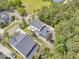 Overhead view of a residence featuring a screened porch and backyard, nestled among lush trees and greenery at 2197 Sandy Point Ln, Mount Pleasant, SC 29466