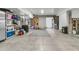 Spacious basement area, ideal for a home gym, features concrete floors and ample storage shelving at 2197 Sandy Point Ln, Mount Pleasant, SC 29466