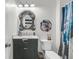 Quirky bathroom with a decorative mirror, themed decor, and a shower with a unique curtain at 2197 Sandy Point Ln, Mount Pleasant, SC 29466
