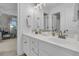 Bright bathroom featuring a double sink vanity with white cabinets and contemporary lighting at 2197 Sandy Point Ln, Mount Pleasant, SC 29466