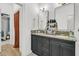 Stylish bathroom featuring double vanities with stone countertops and ample storage space at 2197 Sandy Point Ln, Mount Pleasant, SC 29466