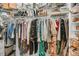 Walk-in closet with clothing, handbags, and shoes at 2197 Sandy Point Ln, Mount Pleasant, SC 29466