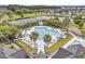 Overhead view displays a large community pool with ample lounge space and palm trees, perfect for summer relaxation at 2197 Sandy Point Ln, Mount Pleasant, SC 29466