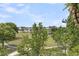 Scenic view of a well-maintained community with lush greenery, a pond, and inviting walking paths at 2197 Sandy Point Ln, Mount Pleasant, SC 29466