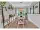 Charming dining room with a rustic table, stylish rug, and plenty of natural light at 2197 Sandy Point Ln, Mount Pleasant, SC 29466