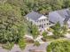 Charming two-story home with double front porches and a beautifully landscaped yard surrounded by mature trees at 2197 Sandy Point Ln, Mount Pleasant, SC 29466