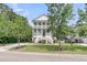 Charming two-story home with a double porch, well-manicured lawn, and attractive landscaping at 2197 Sandy Point Ln, Mount Pleasant, SC 29466