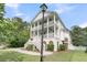 Beautiful two-story home with a welcoming front porch and lush landscaping at 2197 Sandy Point Ln, Mount Pleasant, SC 29466