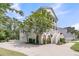 Charming two-story home with a landscaped yard, a large driveway, and a garage at 2197 Sandy Point Ln, Mount Pleasant, SC 29466