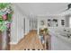Bright and inviting foyer with hardwood floors, neutral paint, and a decorative wreath on the front door at 2197 Sandy Point Ln, Mount Pleasant, SC 29466