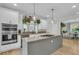 Well-appointed kitchen with granite countertops, stainless steel appliances, and a kitchen island with a gas cooktop at 2197 Sandy Point Ln, Mount Pleasant, SC 29466