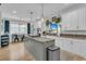 Bright and modern kitchen with granite countertops, a kitchen island with gas cooktop, and stainless steel appliances at 2197 Sandy Point Ln, Mount Pleasant, SC 29466