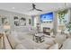 Comfortable living room with a fireplace, large TV, cozy seating, and view into the kitchen at 2197 Sandy Point Ln, Mount Pleasant, SC 29466