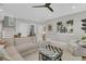 Bright living room with comfortable seating, and an open-concept staircase at 2197 Sandy Point Ln, Mount Pleasant, SC 29466